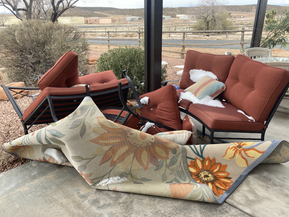 Wind has blown over this outdoor furniture near a swimming pool in St. George Utah
